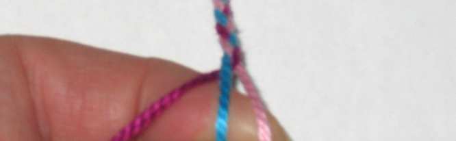 Cross floss on the right over the middle braided bracelet.