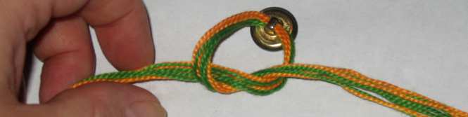 Friendship braided bracelet with dragon button.