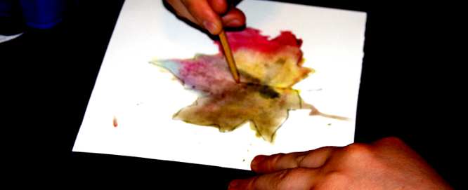 Use the brush handled to draw the leaf veins.
