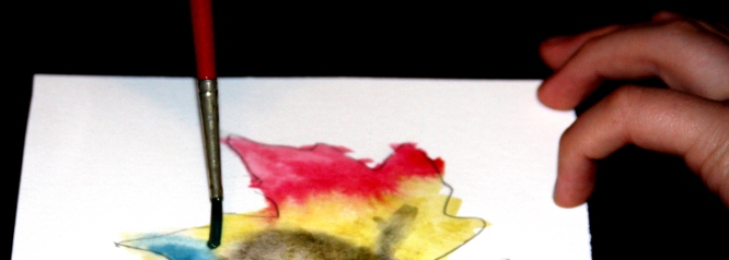 Watercolor paint with spread over moistened leaf.